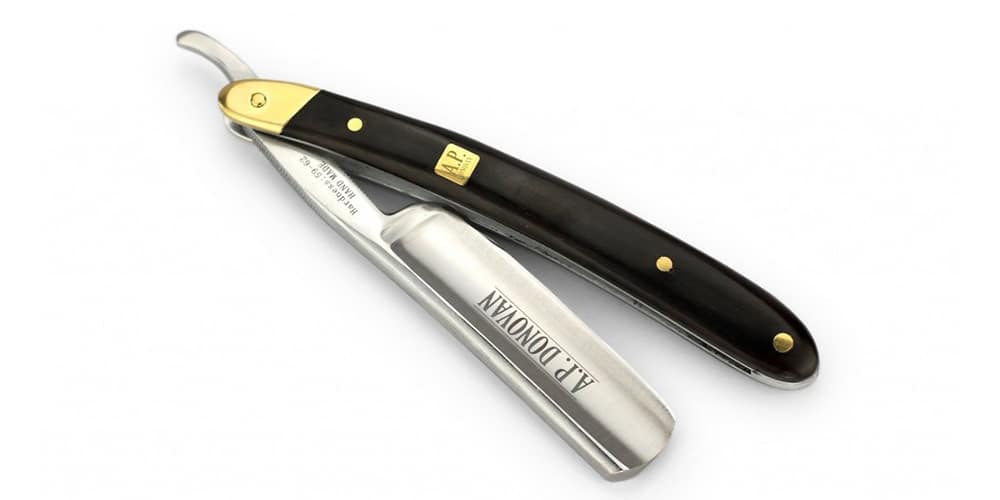 This is a photo of a A.P. Donovan Straight Razor Kit overlaid on a minimalistic white background with a Burbro logo.