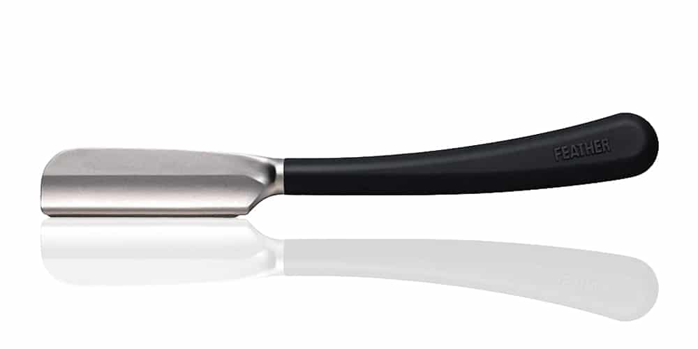 This is a photo of a Black Feather SS Straight Razor overlaid on a minimalistic white background with a Burbro logo.