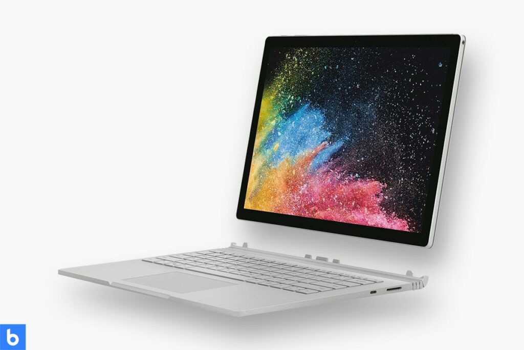 This is a product image in our Best Business Laptop for 2023 article. It is a photo of a Microsoft Surface Book 2 Laptop overlaid on a minimalistic white background with a Burbro logo.