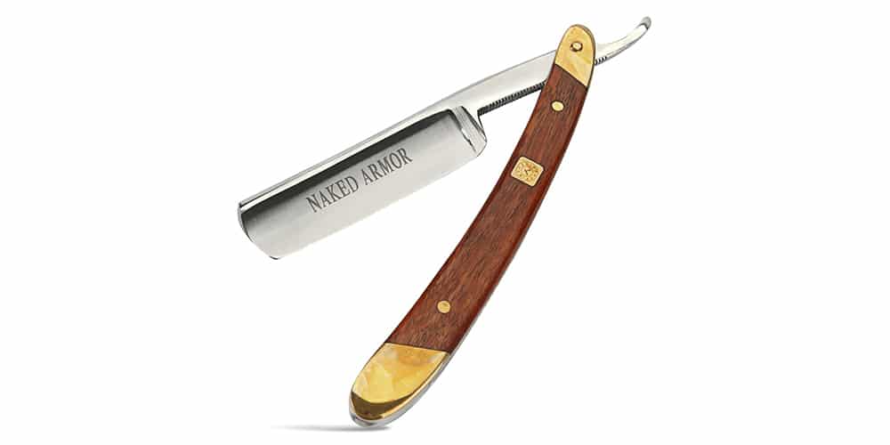 This is a photo of a Naked Armor Straight Razor overlaid on a minimalistic white background with a Burbro logo.