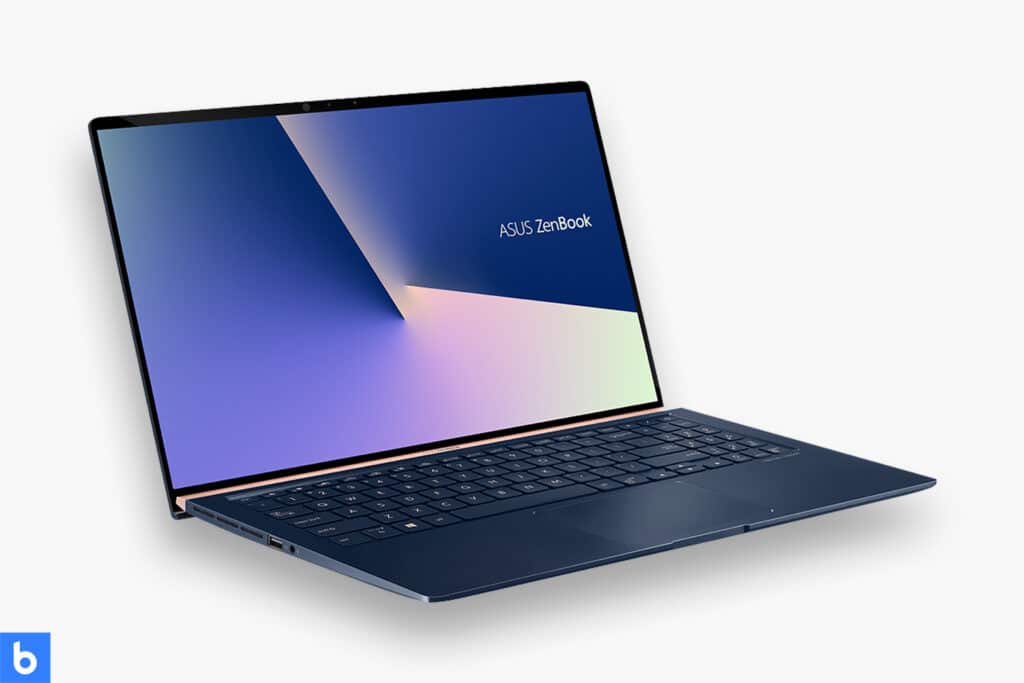 This is a product image in our Best Business Laptop for 2023 article. It is a photo of an Asus Zenbook 15 Laptop overlaid on a minimalistic white background with a Burbro logo.