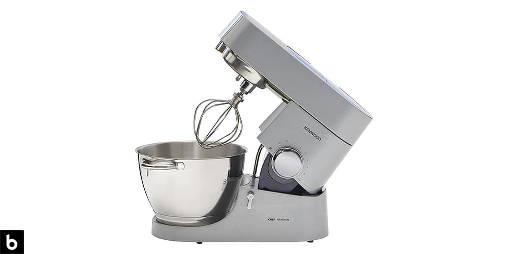 This is a product image in our Best Stand Mixers in 2024 article. It is a photo of a metallic silver Kenwood Chef Titanium Stand Mixer overlaid on a minimalistic white background with a Burbro logo.
