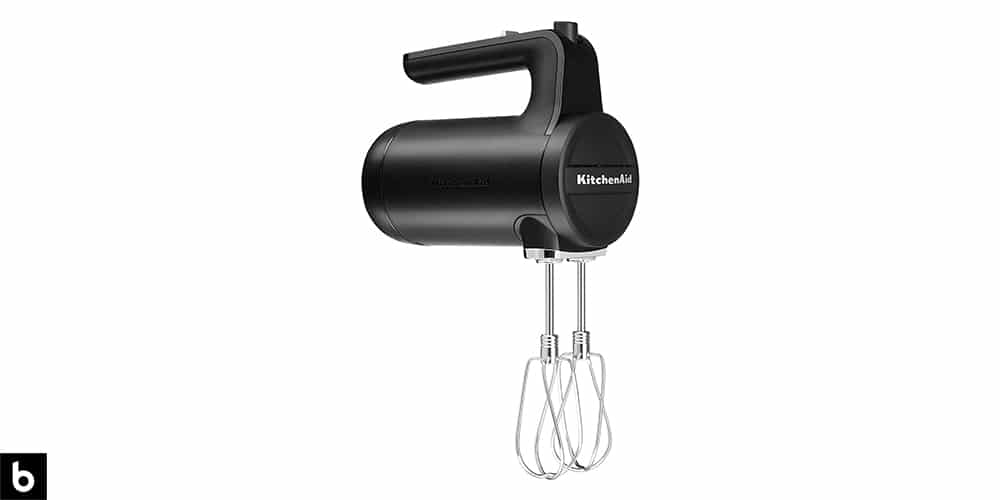 This is a photo of a black and silver colored KitchenAid Cordless Hand Mixer overlaid on a minimalistic white background with a Burbro logo.