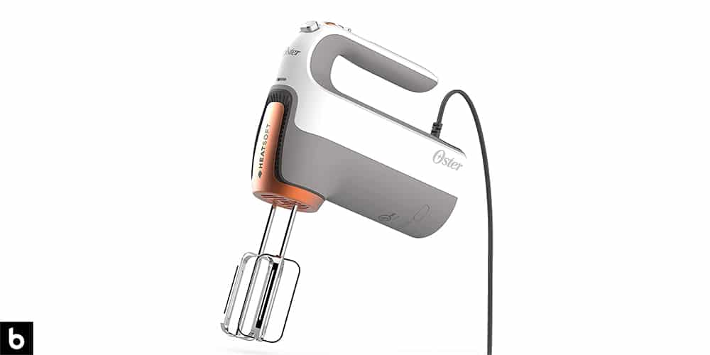 This is a photo of a white and grey colored Oster HeatSoft Hand Mixer overlaid on a minimalistic white background with a Burbro logo.