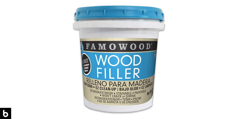 This is a product image in our Best Wood Filler 2024 article. It is a photo of a bucket of FamoWood Latex Filler overlaid on a minimalistic white background with a Burbro logo.