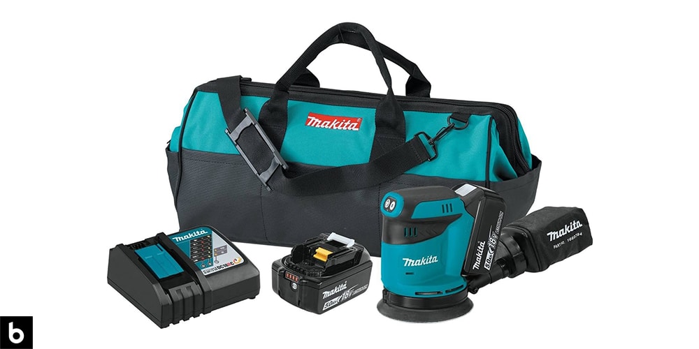 This is a product image in our Best Palm Sander 2023 article. It is a picture of a Makita XOB01T Palm Sander kit. There is also a carrying bag, battery pack, and charging port in the photo.