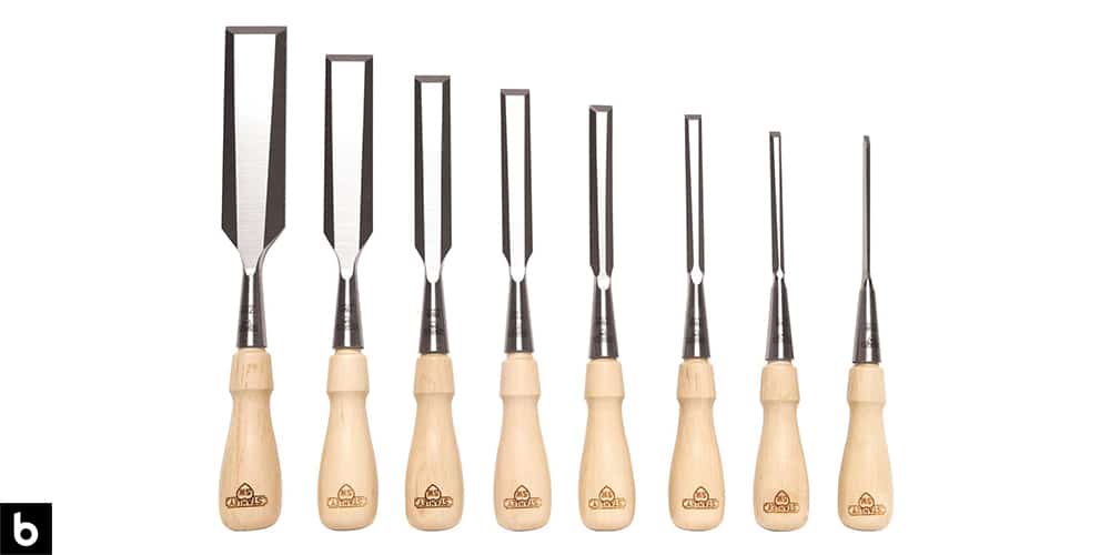 This is a photo of the Stanley Sweetheart Chisel Set, which we’ve chosen as the best chisel set for woodworking in 2023. The chisels have a light-color wood handle with a stainless-steel shaft. This image is overlaid on a white minimalistic background with a Burbro logo in the corner.