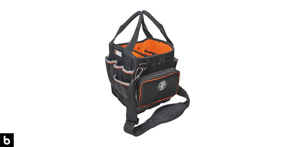 This is a picture of an orange and black Kleins Electricians Tool Bag overlaid on a white background.