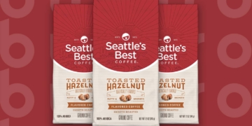 This is the cover photo for our Best Ground Coffee article. It features 3 bags of Seattle's Best Toasted Hazelnut ground coffee overlaid on a red background with embossed Burbro logo.