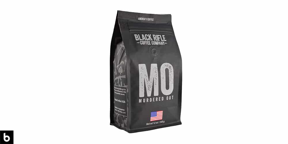 This is a product photo, featuring a black and grey bag of 'MO; Black Rifle coffee beans.