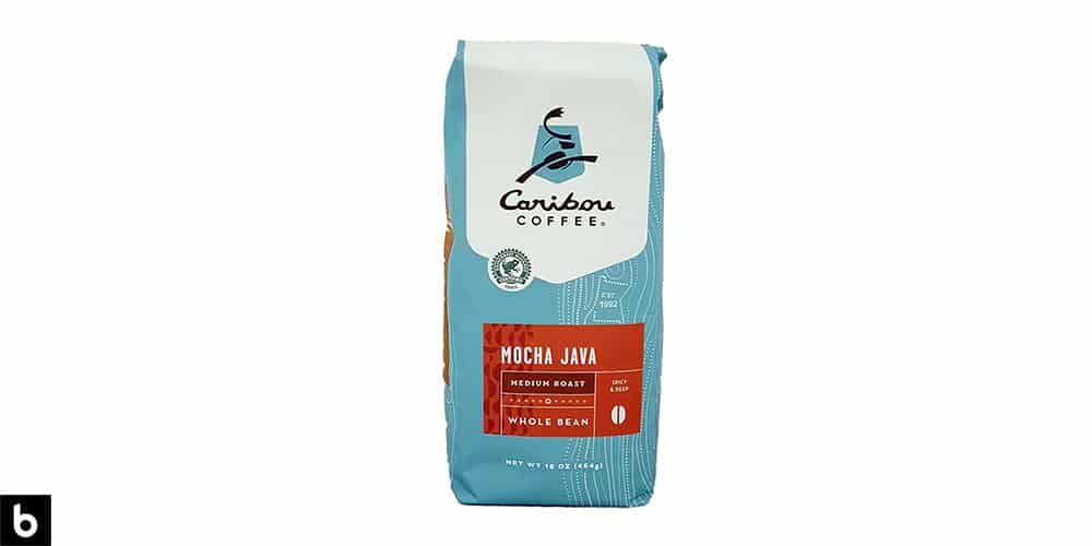 This is a product image of a light blue bag of Caribou Coffee 'Mocha Java' medium roast coffee beans.