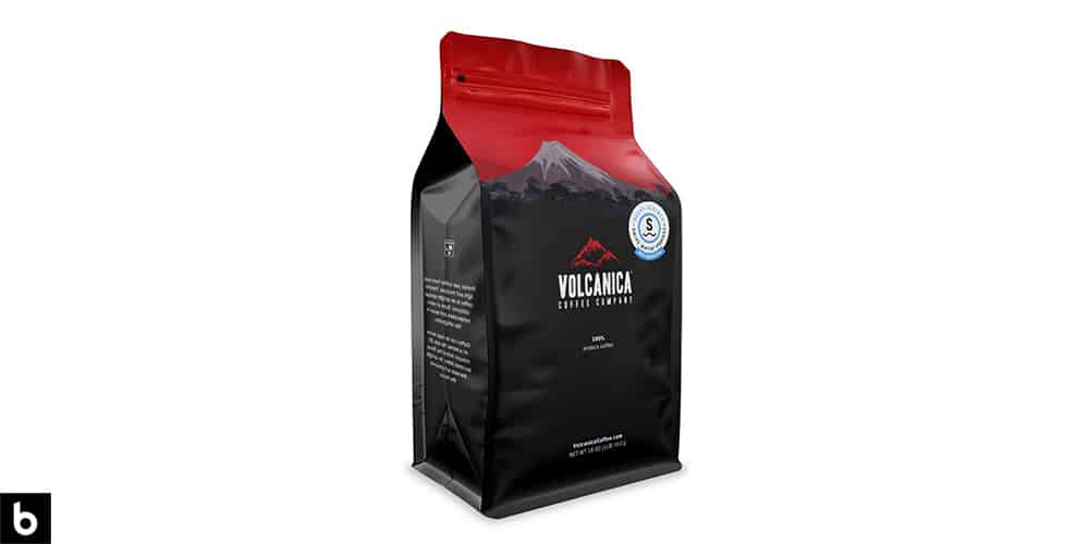 This is a product image, featuring a black and red bag of Costa Rica Volcanica Coffee.