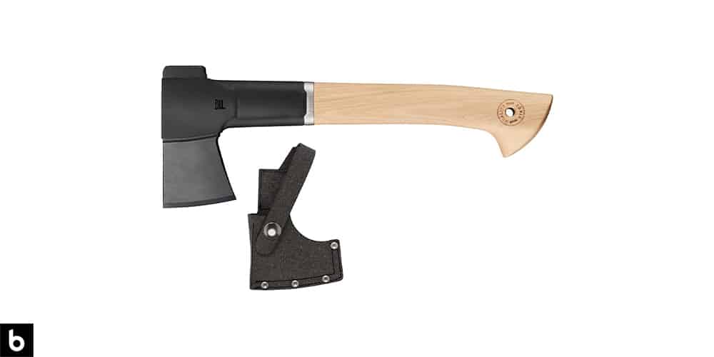 This is a product image, featuring a small Fiskars hatchet/axe, with a sheath.