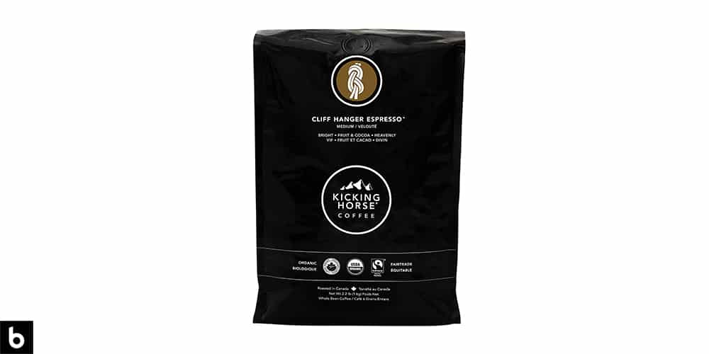 This is a product image, featuring a black bag of Kicking Horse 'Cliff Hanger' Espresso.