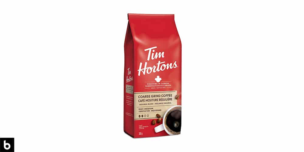 This is a product photo, featuring a red bag of Tim Hortons coffee beans.