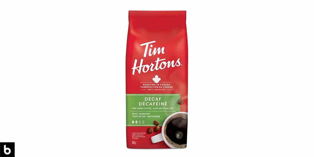 This is a product photo, featuring a red and lime green bag of Tim Horton's decaf coffee.
